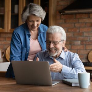 older couple looking at a computer