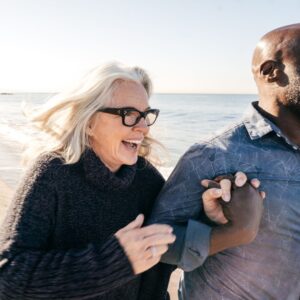couple holding hands on the beach