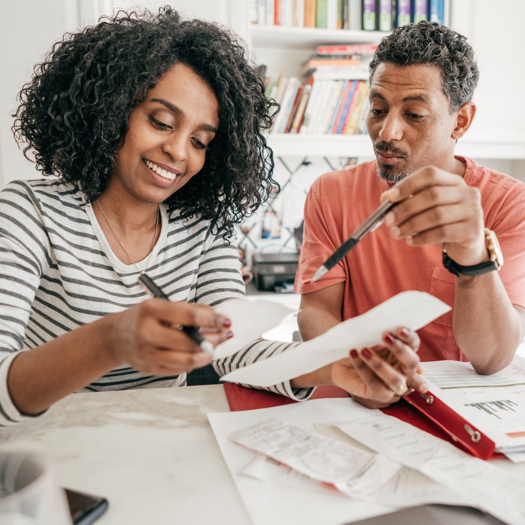 Couple reviewing their taxes in their home