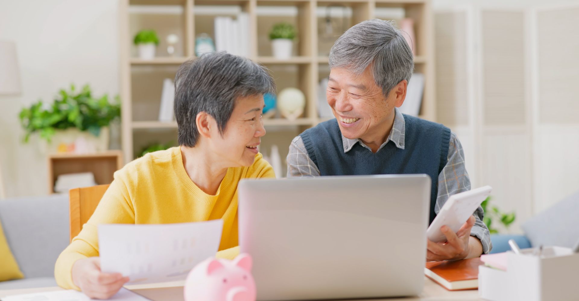 Happy couple discussing finances