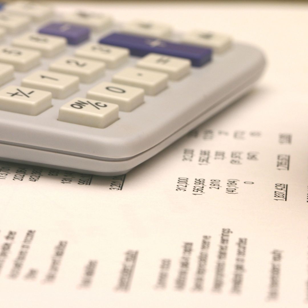 close up of a calculator on top of finance documents