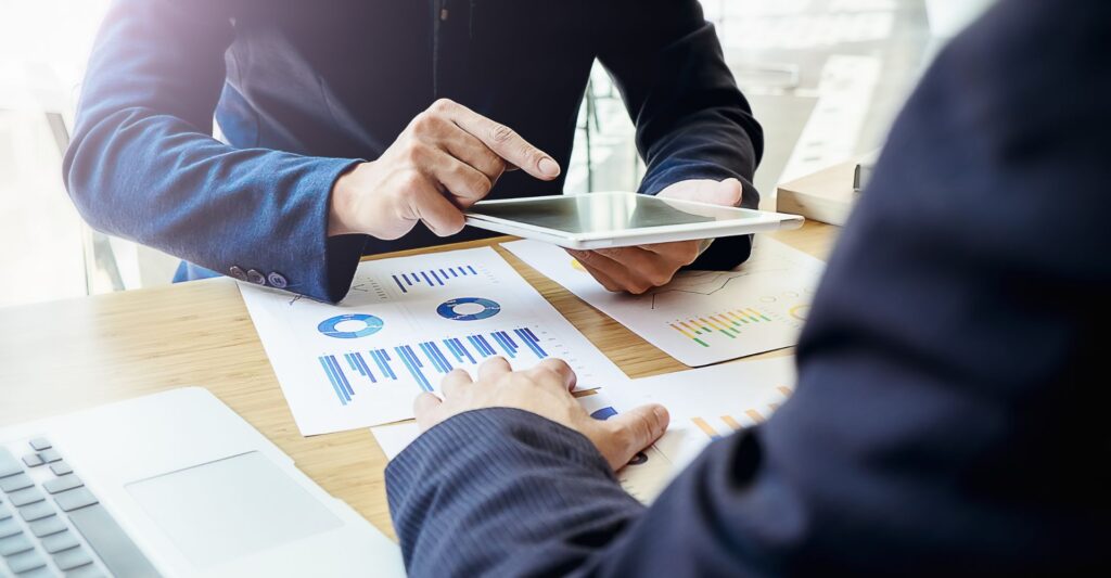 two bussiness professionals assessing financial documents