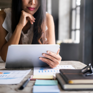 woman on tablet doing finances