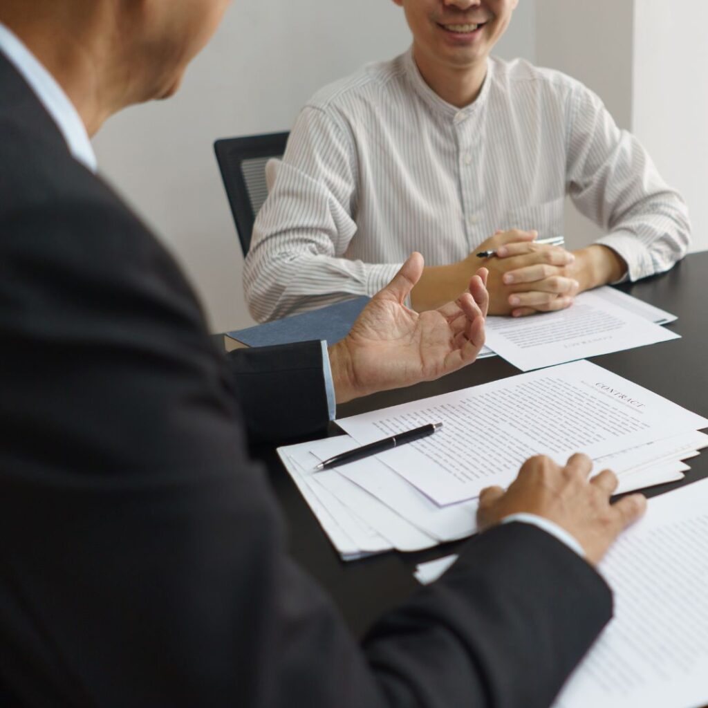 people discussing paperwork
