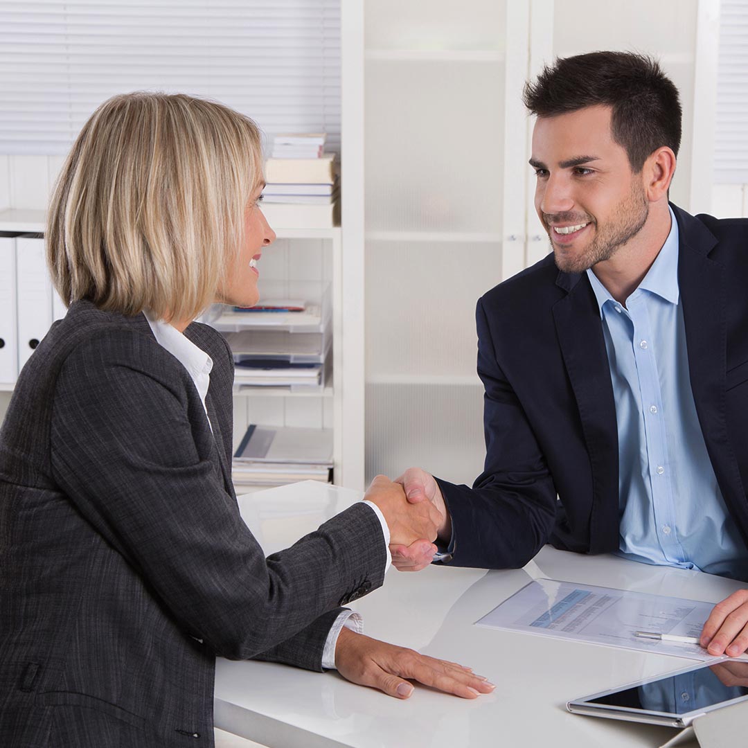 business man and woman shaking hands