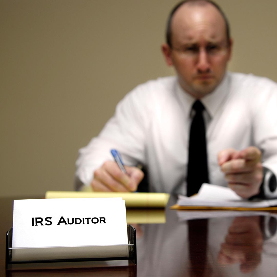 IRS Auditor at his desk
