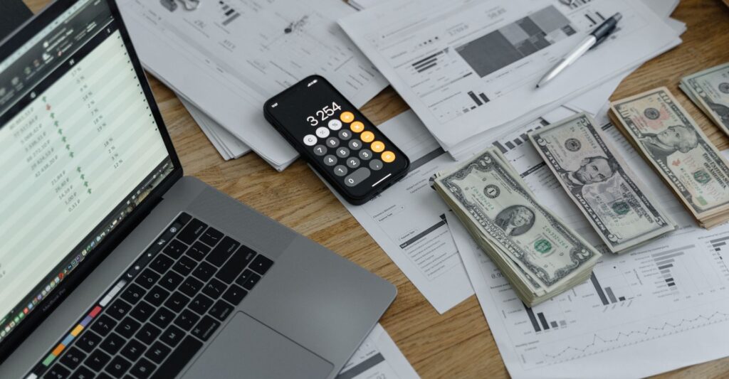 financial plans, money and calculator on a desk