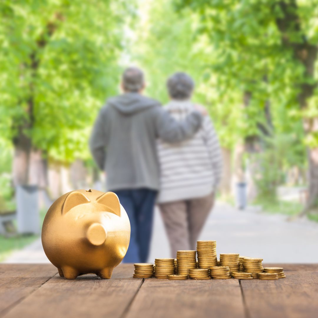 senior couple walking away from a table with coins