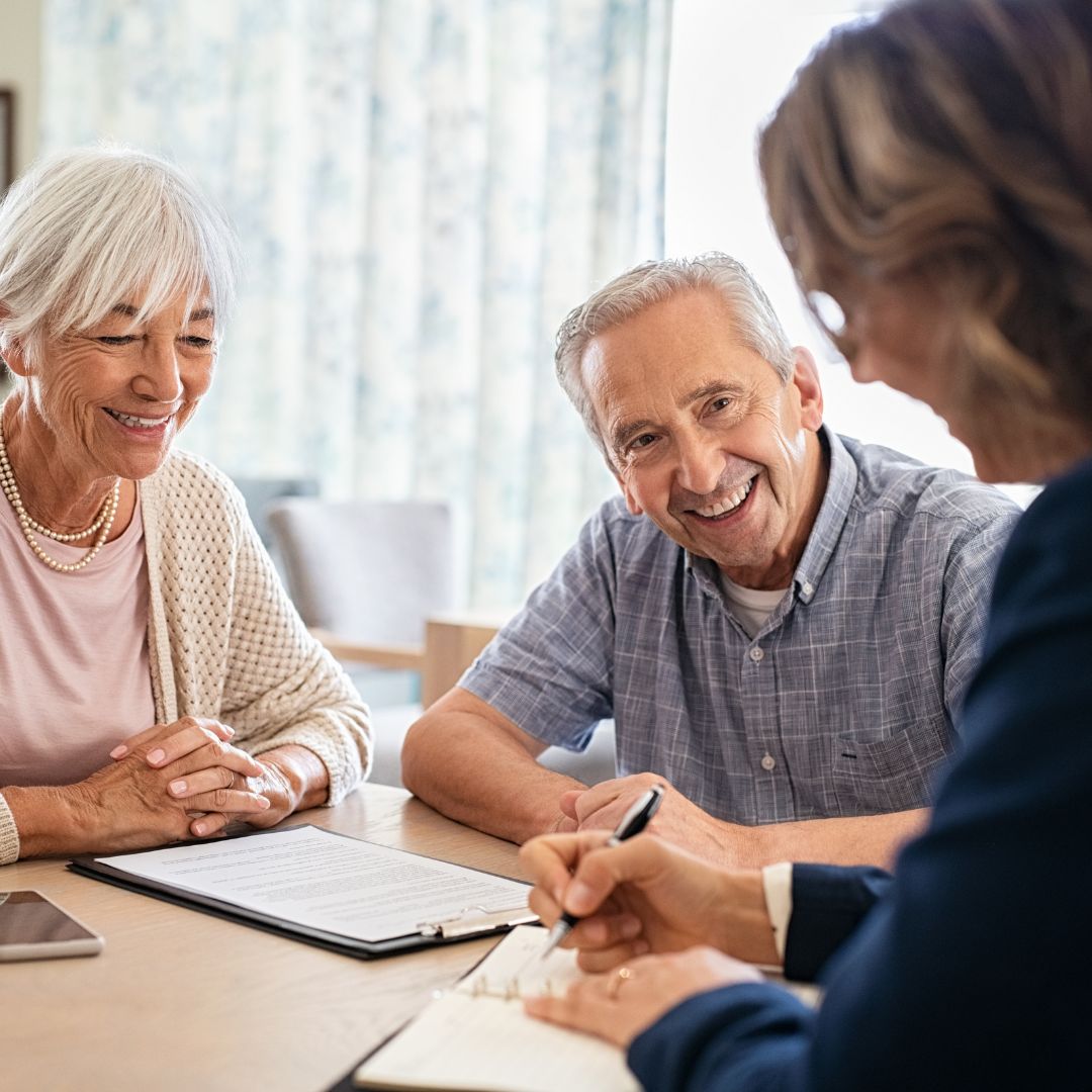 happy couple with financial advisor