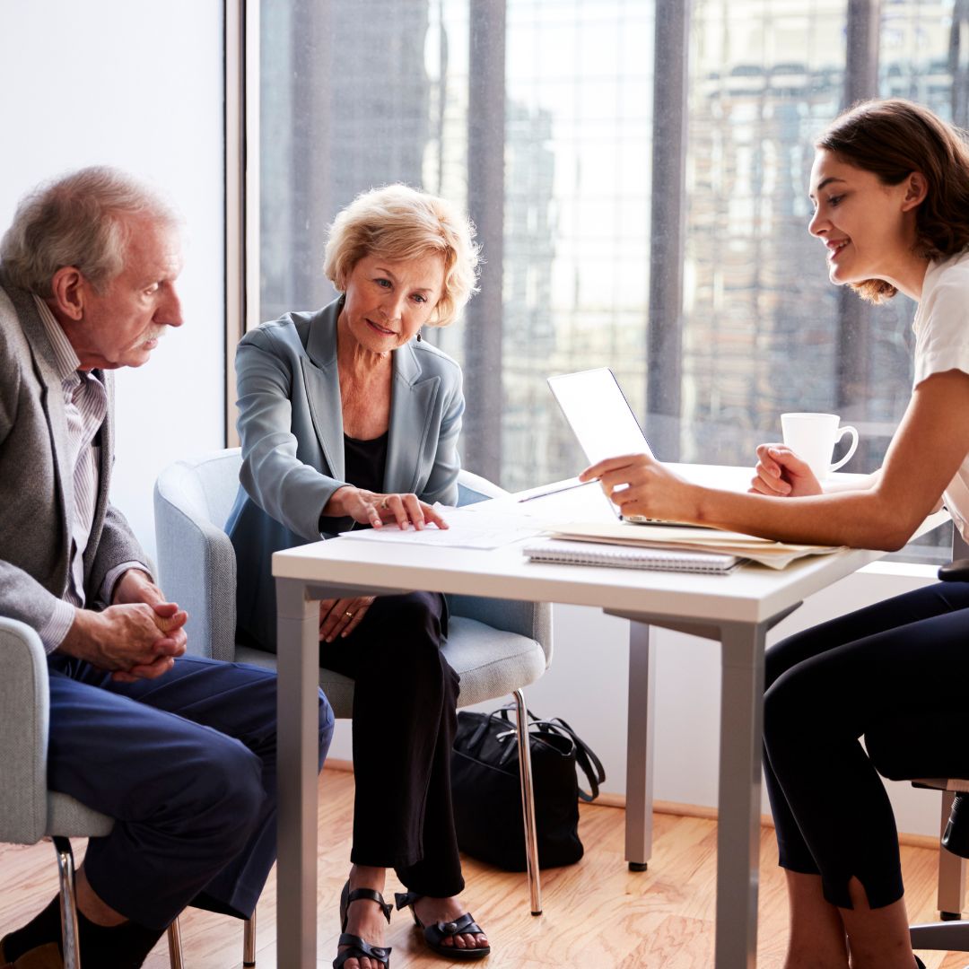 financial consultant with elderly couple