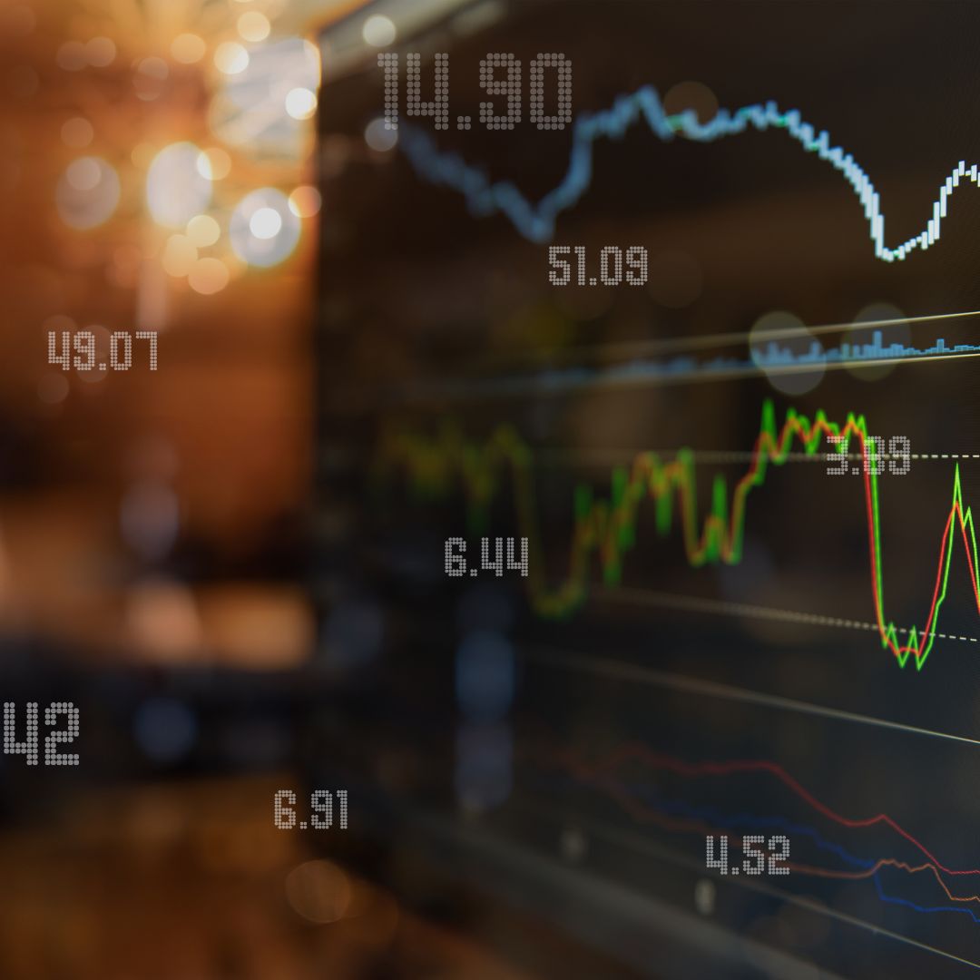 a computer with stocks going up and down