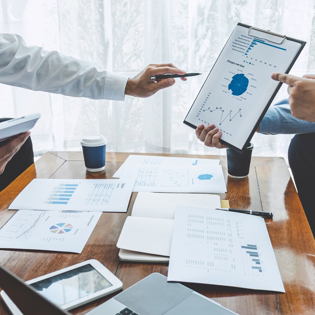 a team looking over financial numbers