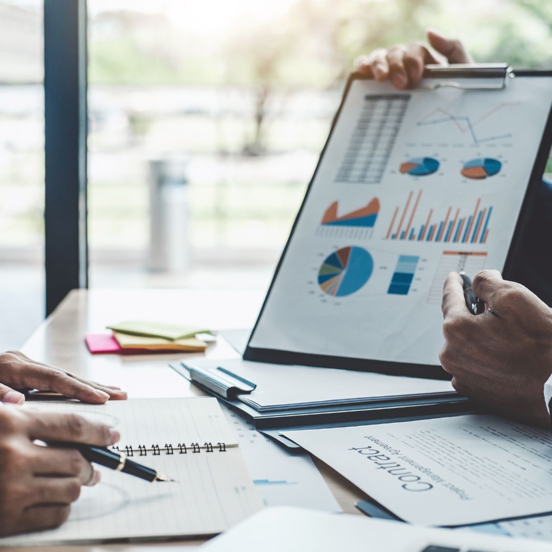 a financial planner showing a client numbers