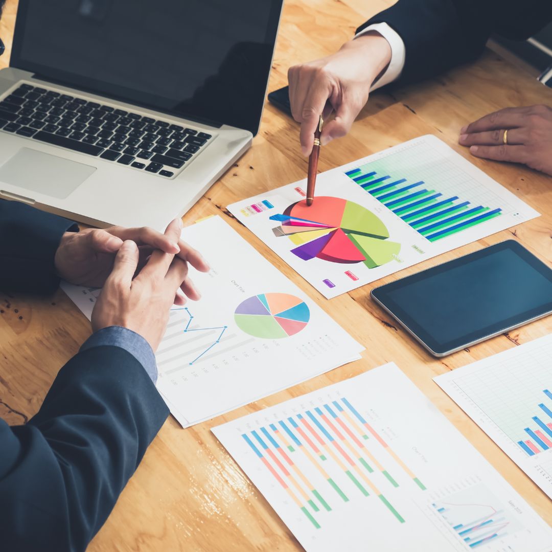 two people looking over charts