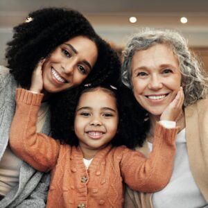 3 generations of ladies sitting together 