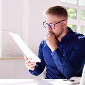 Person reviewing piece of paper