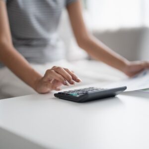Woman doing math with a calculator