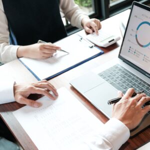 Two people looking at graphs