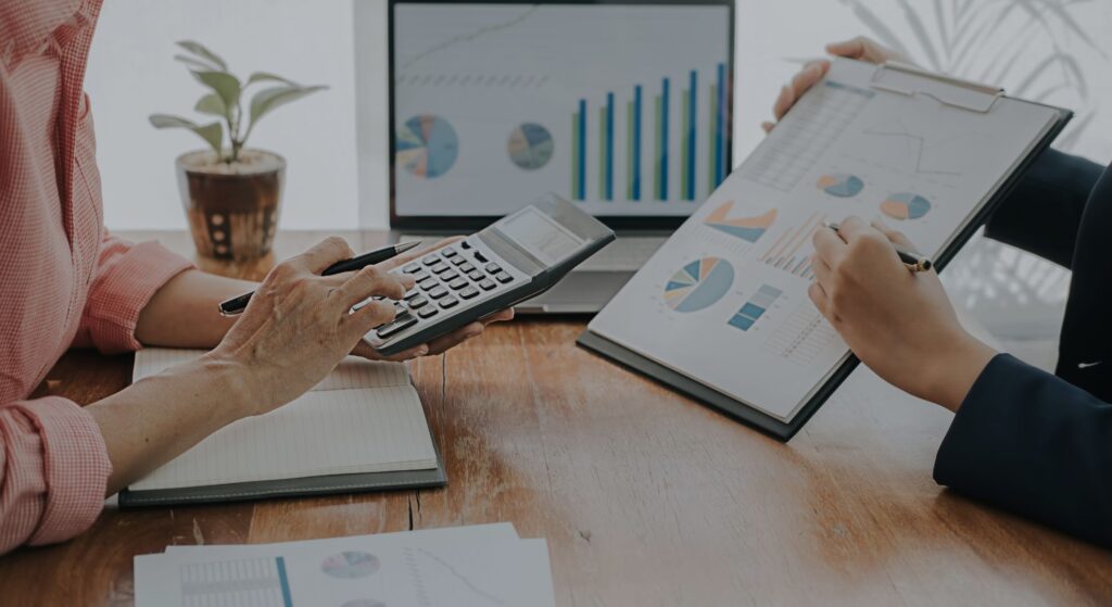 people looking at financial papers