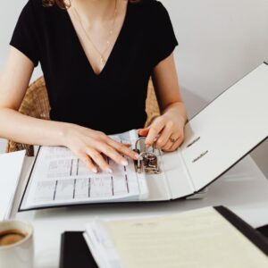 a financial advisor looking through binder